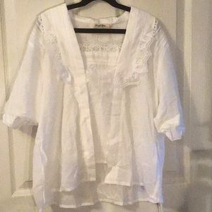 Simple retro blouse XX never worn. Tags. Comes with a cami.